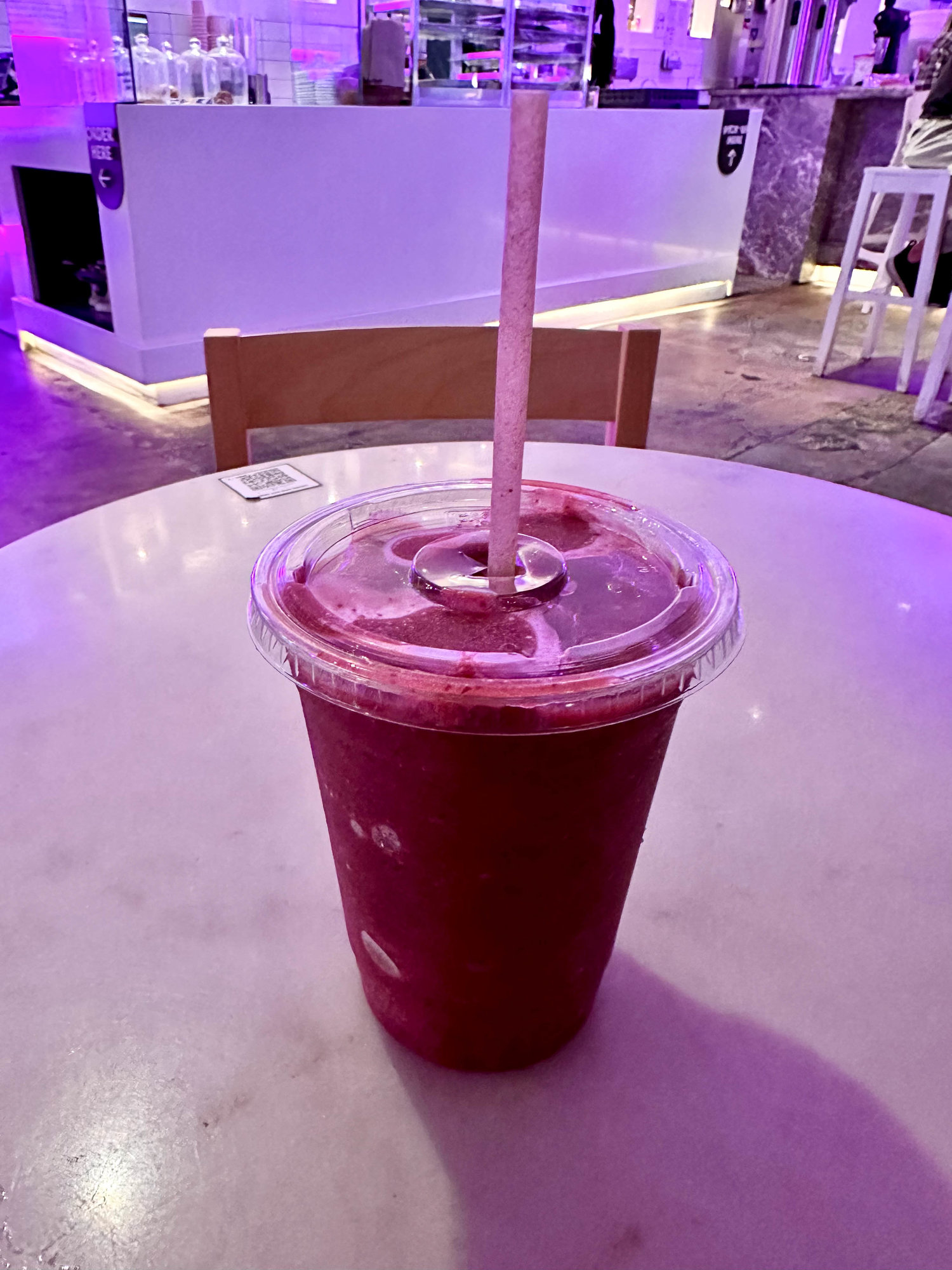 purple smoothie in a plastic cup